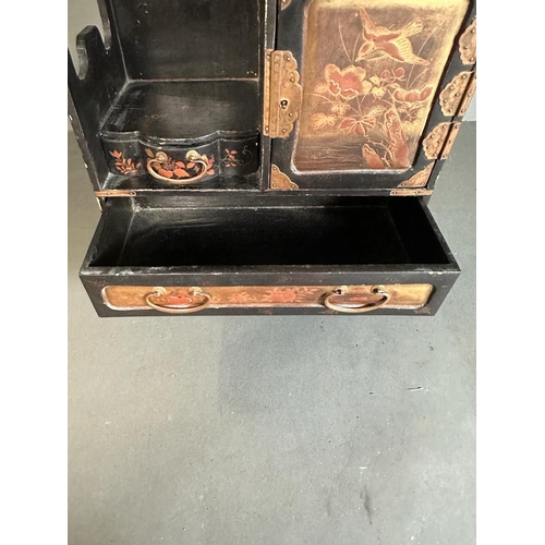 684 - A Japanned jewellery box with drawers and cupboard opening to three small drawers 44.5cm H