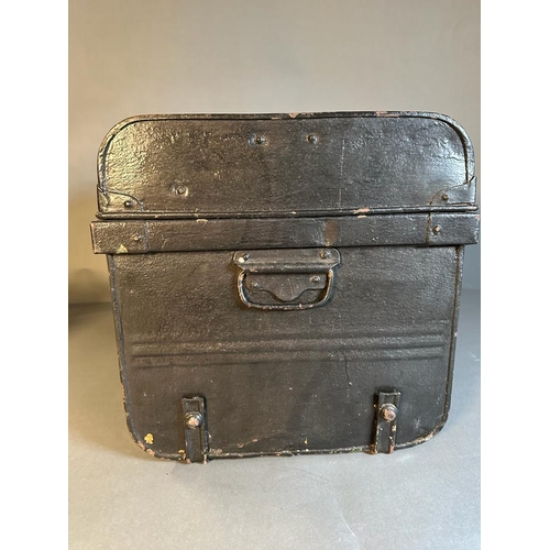 699 - A vintage black painted lockable storage trunk