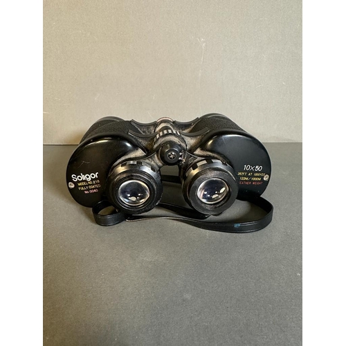 703 - A boxed pair of Soligor binoculars