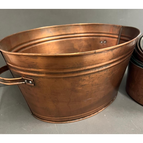 709 - A set of five copper pans and one metal two handle bucket