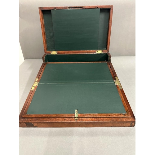 71 - A mahogany and brass writing slope with green leather interior