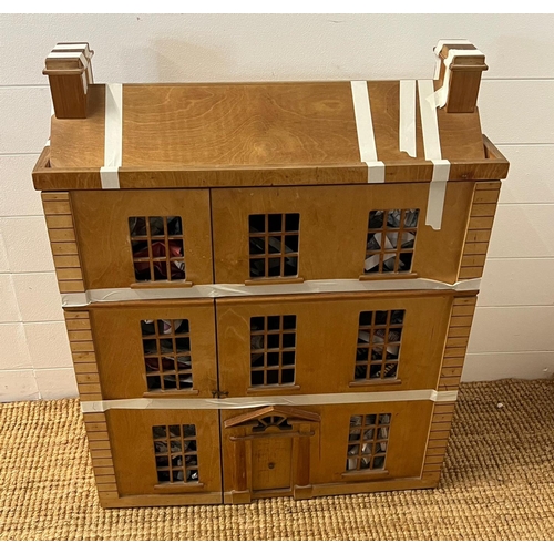 732 - A wooden town house dolls house with furniture (H85cm W67cm D25cm)