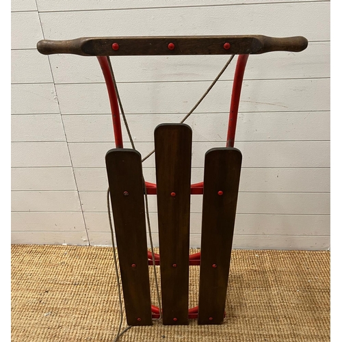 735 - A vintage metal and wooden sledge (H26cm W110cm D62cm)