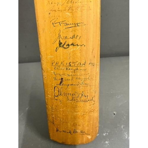 736 - A signed miniature cricket bat, England V Pakistan 1934 (46cm)