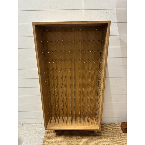 74 - A contemporary oak sixty bottle wine rack (H134cm W68cm D23cm)