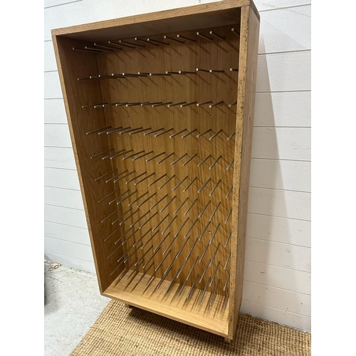 74 - A contemporary oak sixty bottle wine rack (H134cm W68cm D23cm)