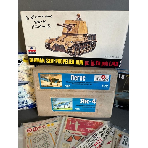 753 - A selection of four boxed model kits, Amodel, Toko and Esci along with a variety of Decals