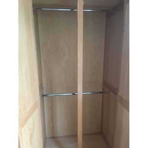 8 - A light oak double wardrobe (H222cm W104cm D60cm)