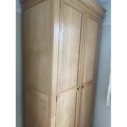 8 - A light oak double wardrobe (H222cm W104cm D60cm)