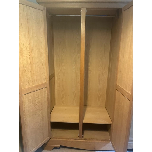 8 - A light oak double wardrobe (H222cm W104cm D60cm)