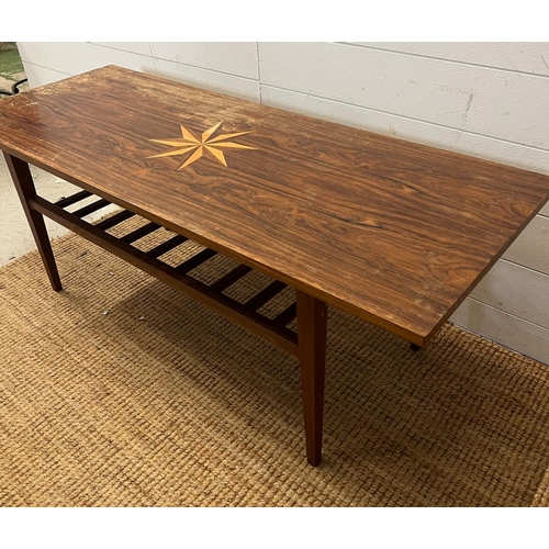 81 - A Mid Century teak coffee table with inlaid star (H46cm W124cm D48cm)