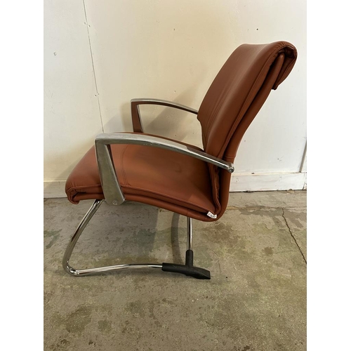 82 - A 1970's office chair by Luxy with brown upholstery on chrome legs