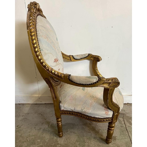 83 - Four gold painted Louis style chairs with scrolling floral upholstery