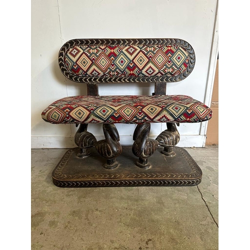 87 - A South African carved bench seat with a Kilim style, upholstered and four carved birds to back and ... 