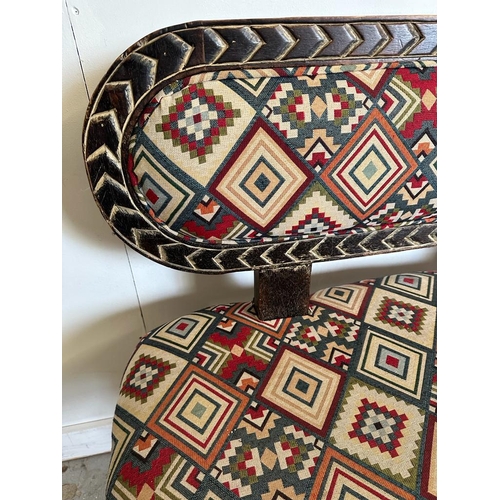 87 - A South African carved bench seat with a Kilim style, upholstered and four carved birds to back and ... 