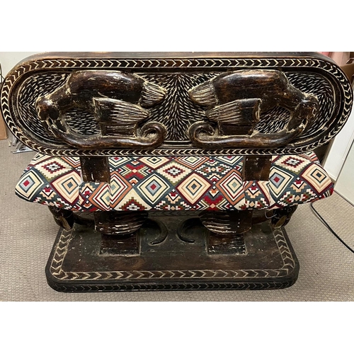 88 - A South African carved bench seat with a kilim style, upholstered and carved birds to back and base