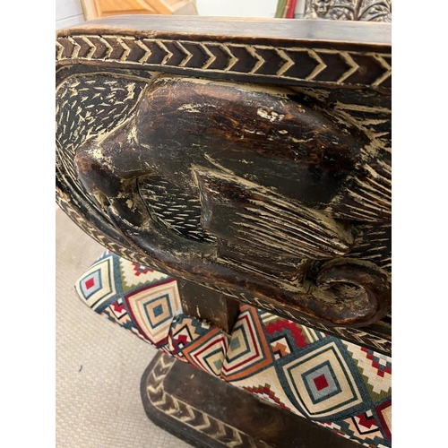 88 - A South African carved bench seat with a kilim style, upholstered and carved birds to back and base