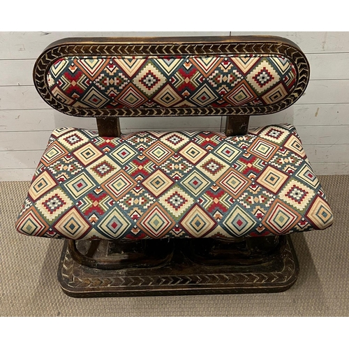 88 - A South African carved bench seat with a kilim style, upholstered and carved birds to back and base