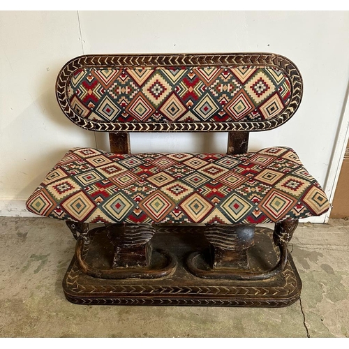 88 - A South African carved bench seat with a kilim style, upholstered and carved birds to back and base