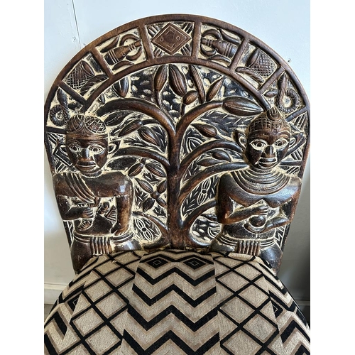 89 - A pair of carved seats with tribal theme carving to back and base