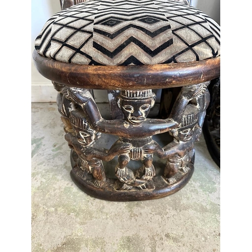 89 - A pair of carved seats with tribal theme carving to back and base