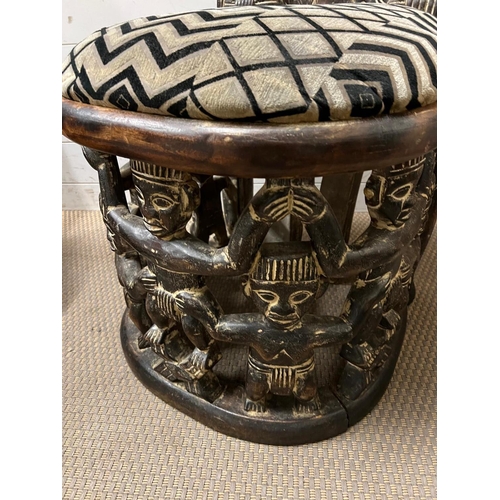 89 - A pair of carved seats with tribal theme carving to back and base