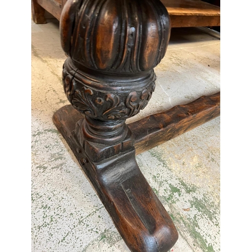 96 - An Elizabethan jointed oak refectory table with three plank top on baluster legs and stretchers (82c... 