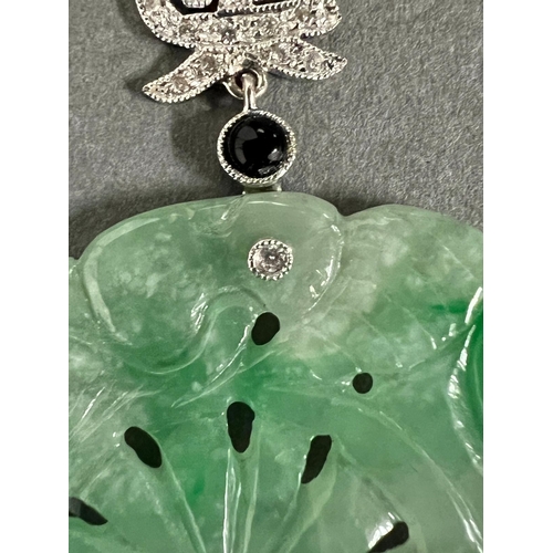 449A - A round Jade and Diamond Chinese pendant on 21ct gold necklace