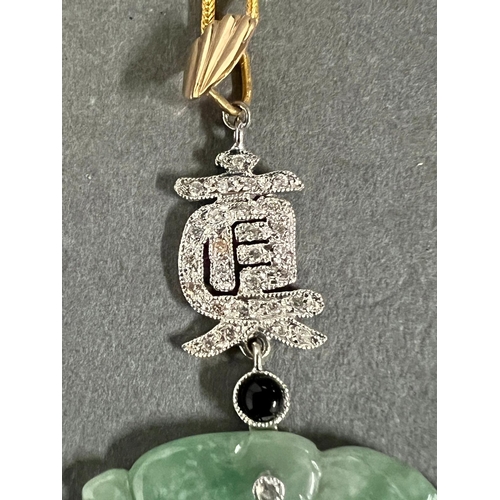 449A - A round Jade and Diamond Chinese pendant on 21ct gold necklace