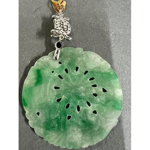 449A - A round Jade and Diamond Chinese pendant on 21ct gold necklace