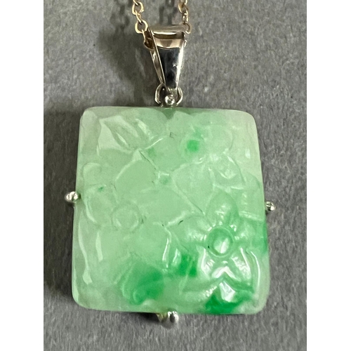 460A - A square jade pendant on a 9ct gold necklace.