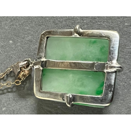 460A - A square jade pendant on a 9ct gold necklace.