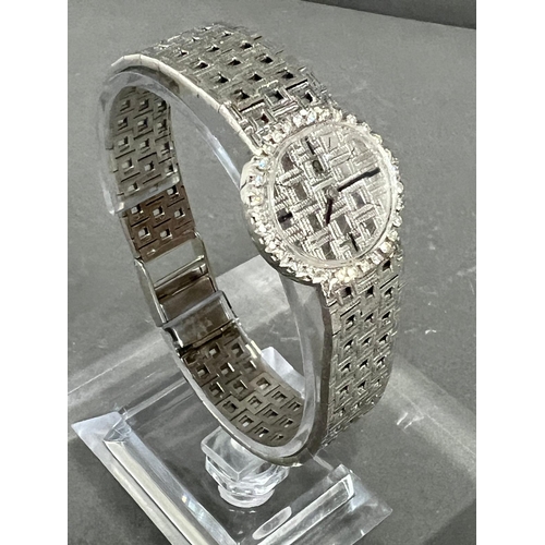 513A - A Ladies 18ct gold and diamond Omega watch, textured white dial, black hourly makers, a 17 jewel man... 