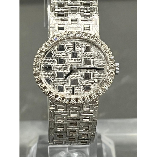 513A - A Ladies 18ct gold and diamond Omega watch, textured white dial, black hourly makers, a 17 jewel man... 