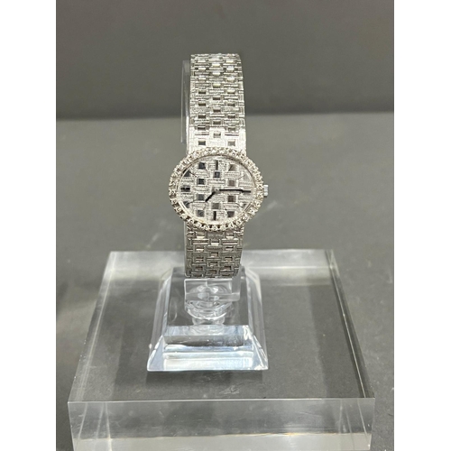 513A - A Ladies 18ct gold and diamond Omega watch, textured white dial, black hourly makers, a 17 jewel man... 