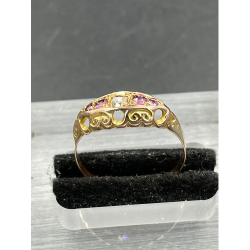 438B - An early 20th Century diamond and garnet boat ring, set with a central rose cut diamond weighing an ... 