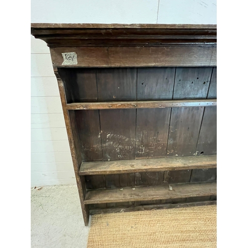 101 - An oak wall hanging plate rack (H68cm W72cm D40cm)