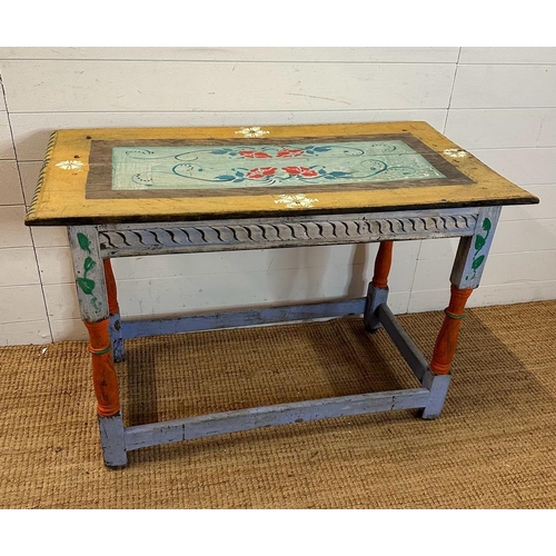 103 - A reclaimed pine painted table with floral detail (H70cm W105cm D56cm)