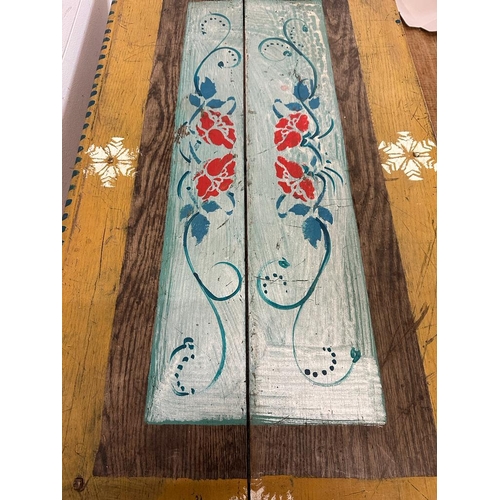 103 - A reclaimed pine painted table with floral detail (H70cm W105cm D56cm)