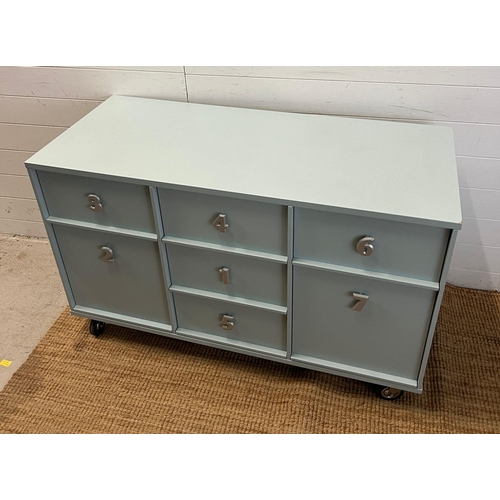 11 - A side cabinet chest of drawers with the drawer handles in the form of numbers (H76cm W123cm D53cm)