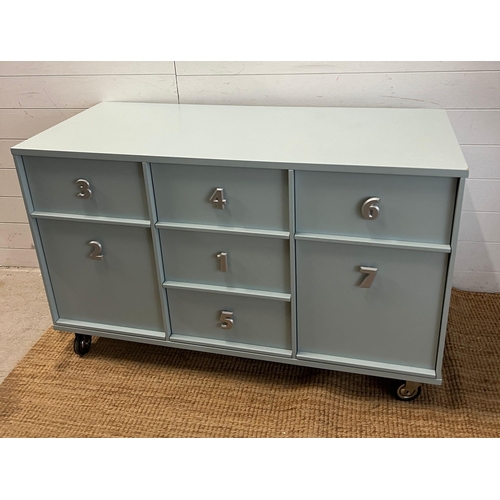 11 - A side cabinet chest of drawers with the drawer handles in the form of numbers (H76cm W123cm D53cm)