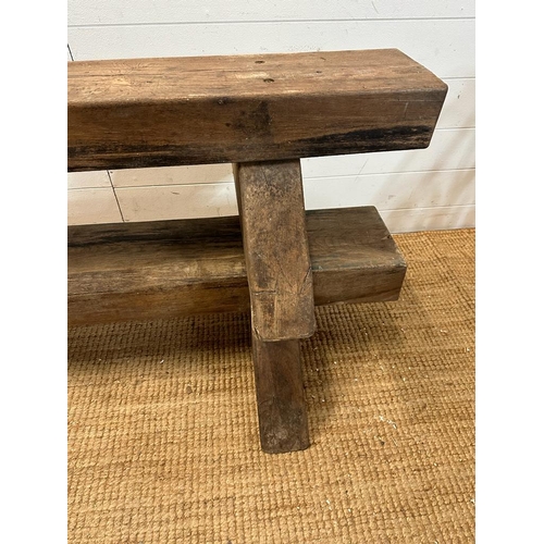 112 - Two reclaimed oak benches on triangular feet (H30cm W180cm)