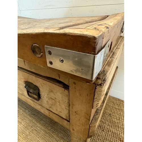 120 - A large reclaimed butchers block on a pine two drawer stand (H70cm W122cm D69cm)