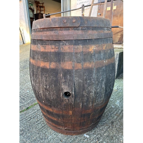 123 - Two reclaimed timber metal banded whisky barrels (H127cm Dia67cm) ( H110cm Dia 75cm)