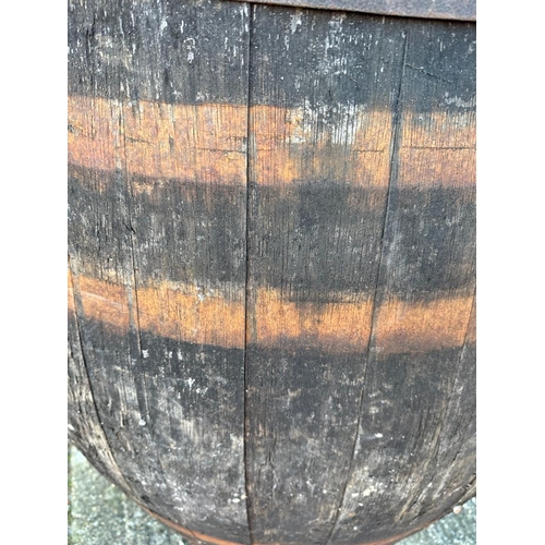 123 - Two reclaimed timber metal banded whisky barrels (H127cm Dia67cm) ( H110cm Dia 75cm)