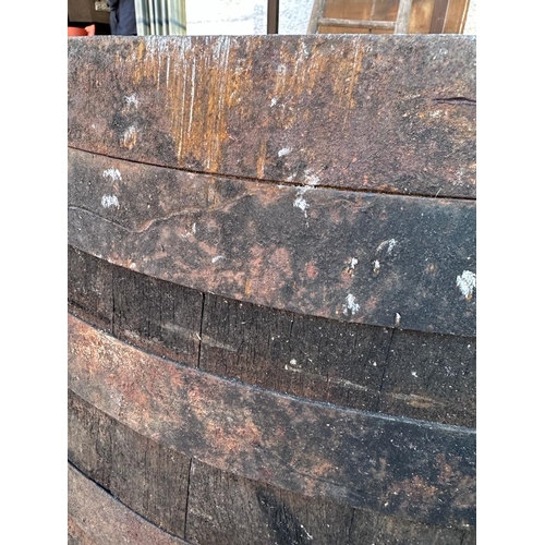 123 - Two reclaimed timber metal banded whisky barrels (H127cm Dia67cm) ( H110cm Dia 75cm)