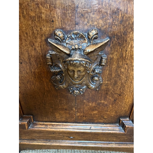 130 - Oak sideboard with carved crest detail to front (H90cm W130cm D50cm)