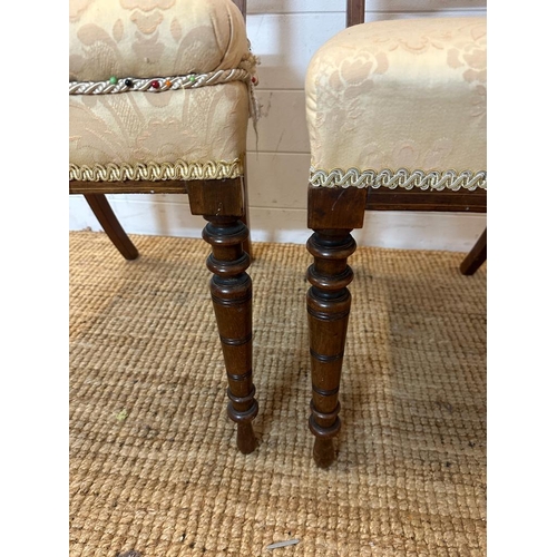 131 - Two Edwardian hall chairs with inlaid backs and turned legs