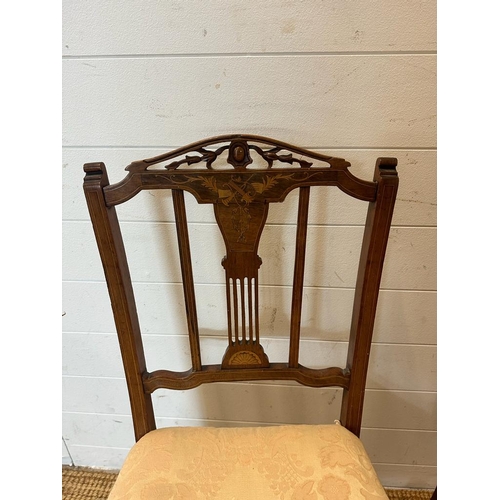 131 - Two Edwardian hall chairs with inlaid backs and turned legs