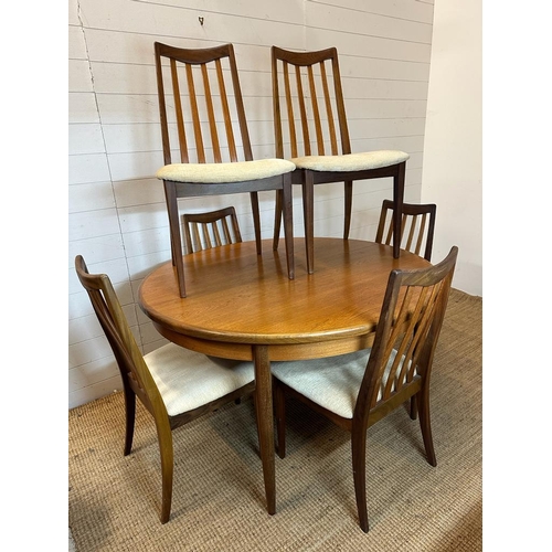 144 - A Mid Century G-Plan circular single leaf dining table and six chairs (Dia122cm)